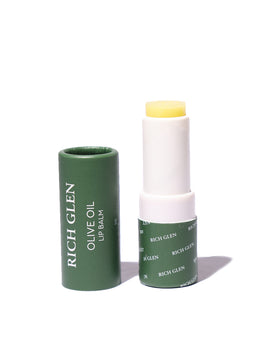 Tube of Rich Glen's Olive Oil Lip Balm on table